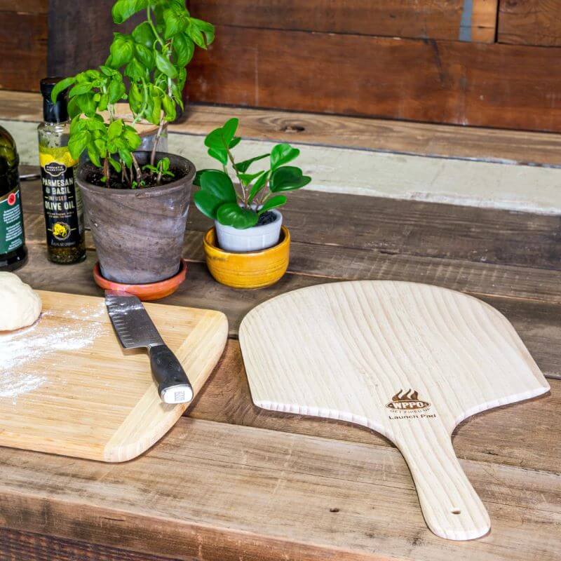 WPPO 12x24 inch Short Handle Wood Peel on table
