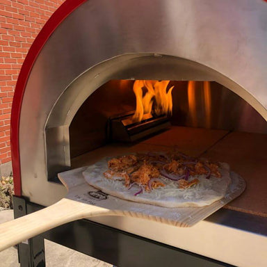 WPPO Long Handle Wood Pizza Peel removing pizza from oven