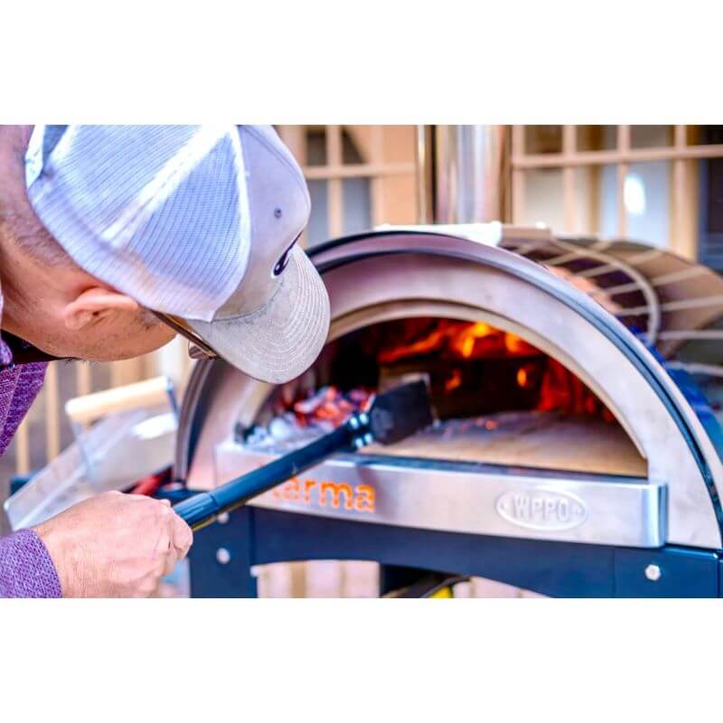 WPPO Wood Fired Pizza Oven Coal Rake with guy cleaning pizza oven