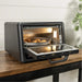 Blackstone E Series Electric Pizza Oven and Air Fryer open with food inside