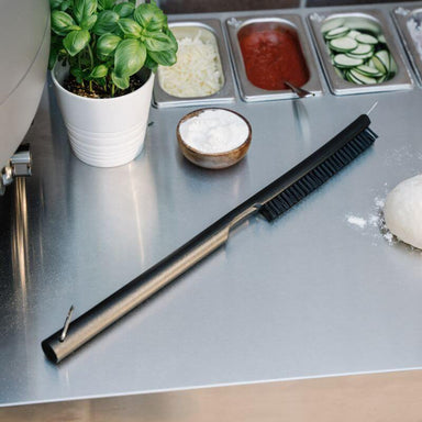Everdure Pizza Oven Cleaning Brush On Table