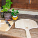 WPPO 14x24 inch short handle wood peel on table