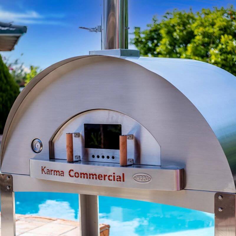 WPPO Karma 55 Commercial Wood Fired Pizza Oven closeup view in front of pool