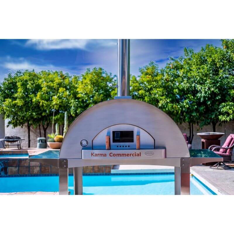 WPPO Karma 55 Commercial Wood Fired Pizza Oven front view in front of pool